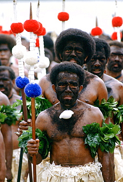 Fijian warriors faces painted black in the traditional manner while attending a tribal gathering in Fiji, South Pacific