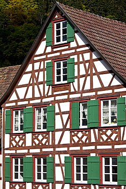 Windows and wooden shutters of quaint timber-framed house in Schiltach in the Bavarian Alps, Germany