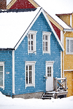 Traditional architecture wooden buildings along Storgata in the quaint area of the city of Tromso, in the Arctic Circle in Northern Norway