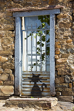 Cat drawn on gate at Potes in Picos de Europa, Asturias, Northern Spain