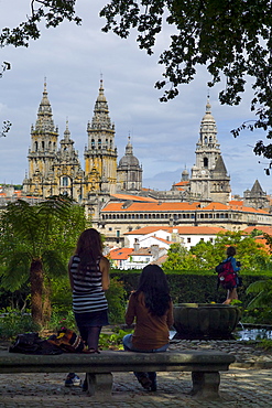 Young tourists in Alameda Park view Roman Catholic cathedral, Catedral de Santiago de Compostela, cityscape, Galicia, Spain