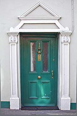 Brightly coloured turquoise door and Georgian style arch in Youghal, East Cork, County Cork, Southern Ireland