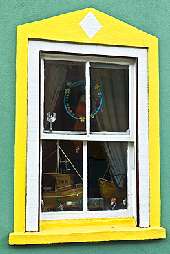 Aquamarine colour wall and yellow window border in Kinsale, County Cork, Ireland