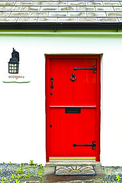 Front door in stable-door style on traditional whitewashed cottage near Quilty, County Clare, West of Ireland