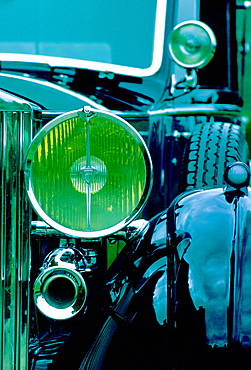 Detail showing lamps and horns of a Rolls Royce motor car which has been carefully restored as a classic car, Gloucestershire, United Kingdom