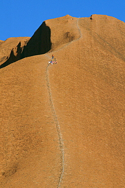 Tourists visiting Ayers Rock in Australia