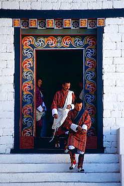 Government officials leave Tashichho Dzong, the Government administration building in Thimpu, Bhutan.