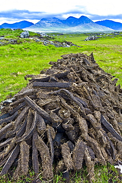 Stacked peat in turf bog on the Old Bog Road near Roundstone, Connemara, County Galway