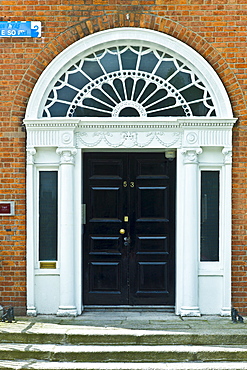 Traditional doorway with fanlight windows in Merrion Square famous for its Georgian architecture, Dublin, Ireland