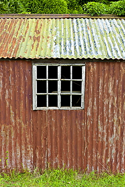 Rusty corrugated iron shed in the Cotswolds village of Bledington, Oxfordshire, UK