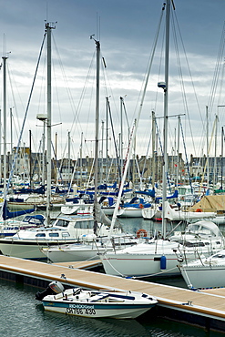 Yachts and power boats moored in the Marina at St Vaast la Hougue channel port in Normandy, France