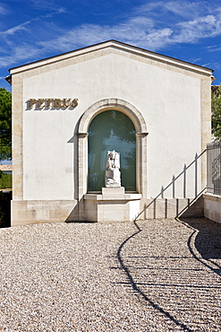 The famous Chateau Petrus wine estate, with statue of St Pierre, at Pomerol in the Bordeaux region of France