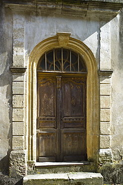 Traditional French doorway in quaint town of Castelmoron d'Albret in Bordeaux region, Gironde, France