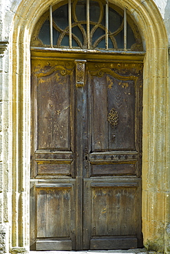 Traditional French doorway in quaint town of Castelmoron d'Albret in Bordeaux region, Gironde, France