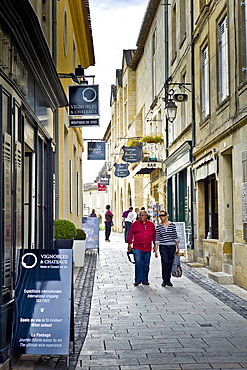 Tourists stroll in St Emilion in the Bordeaux region of France