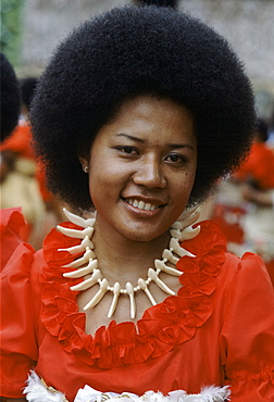 Fijian girl in traditional costume with bone necklace during native ceremony at tribal gathering in Fiji, South Pacific