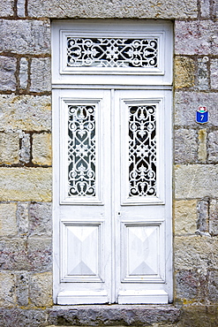 Ornate doorway in Domfront medieval town, Normandy, France