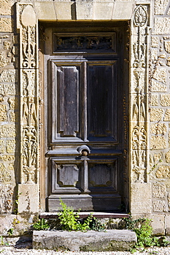 Typical old French doorway in the town of Les Eyzies in the Dordogne region of France