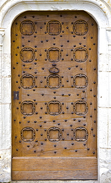 Oak door at Chateau du Rivau, 15th and 16th Century Renaissance architecture, near Chinon in the Loire Valley, France