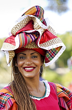 Woman wearing Jamaican national costume for cultural display at  Governor General's Residence, Kings House, Kingston, Jamaica