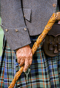 Traditional Scottish kilt and tweed jacket sporran and stick at the Braemar Royal Highland Gathering, the Braemar Games in Scotland