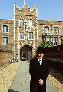 Porter in traditional top hat and tails at Jesus College, Cambridge University, England, UK