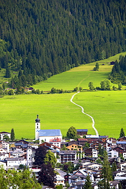 Church and village of Flims in mountain pass in the Graubunden region of Switzerland, Europe