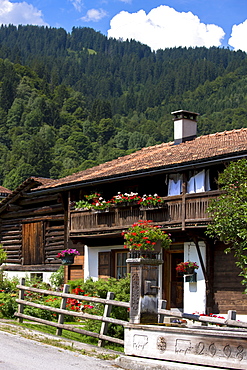 Typical Swiss wooden chalet style house in Serneus near Klosters in Graubunden region, Switzerland, Europe