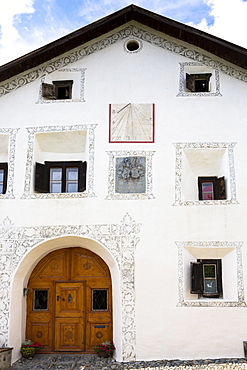 House in the Engadine Valley in the village of Guarda with old painted stone 17th century buildings, Graubunden, Switzerland, Europe