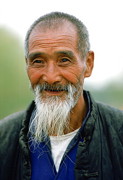 An old man with grey beard in Xian, China