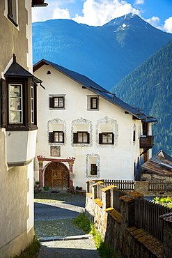 Old painted stone 17th century buildings in the village of Guarda, Engadine Valley, Graubunden, Switzerland, Europe