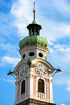 Baroque style 17th century clock tower of Spitalskirche in Maria Theresien Strasse in Innsbruck, the Tyrol, Austria, Europe