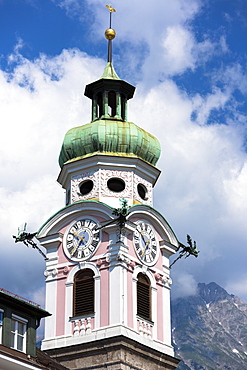 Baroque style 17th century clock tower of Spitalskirche in Maria Theresien Strasse in Innsbruck, the Tyrol, Austria, Europe