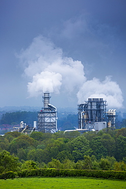 Steaming smoke stacks at Kronospan Factory making wood based panels, chipboard and MDF at Chirk in Wrexham, Wales, United Kingdom, Europe