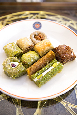 Plate of traditional Turkish honey covered sweetmeats, baklava, dessert of filo pastry and nuts, Istanbul, Turkey, Eurasia