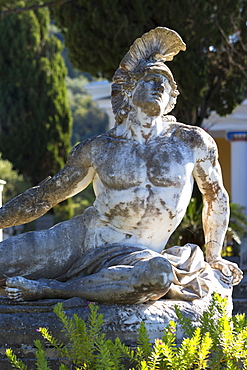 Stone statue of reclining figure of Dying Achilles (Achilleas thniskon) at Achilleion Palace, Museo Achilleio, in Corfu, Greek Islands, Greee, Europe