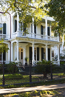 Neo-classical clapboard grand house with double gallery and columns in the Garden District, New Orleans, USA