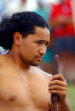 A Maori man with spear  at a tribal gathering in New Zealand