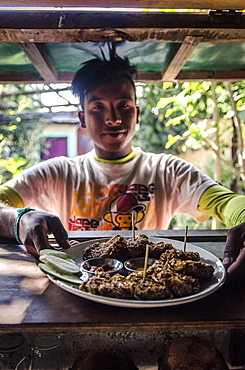 A waiter prepares to serve pakoras, Pokhara, Nepal, Asia