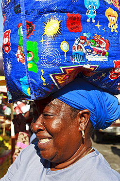 Lady with shopping bag on head, market, Roseau, Dominica, West Indies, Caribbean, Central America