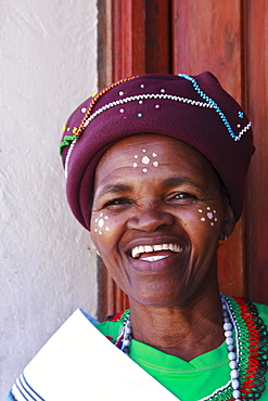 Resident in traditional dress at her house, Langa Township, Cape Town, South Africa, Africa