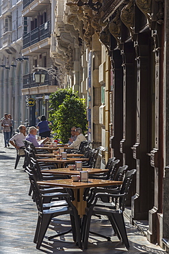 Men sit at cafe tables in the main street, Cartagena, Murcia Region, Spain, Europe