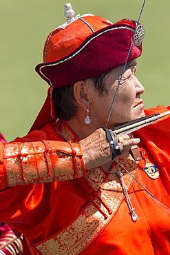 Lady archer takes aim, National Archery Tournament, Archery Field, Naadam Festival, Ulaan Baatar (Ulan Bator), Mongolia, Central Asia, Asia