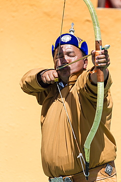 Male archer takes aim, National Archery Tournament, Archery Field, Naadam Festival, Ulaan Baatar (Ulan Bator), Mongolia, Central Asia, Asia