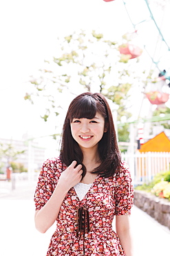 Portrait of a Japanese girl at an amusement park