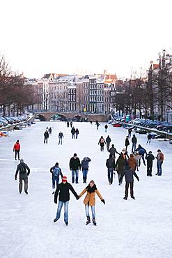 People ice skating in Amsterdam, Netherlands