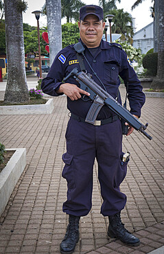 An armed policeman in El Salvador, Central America