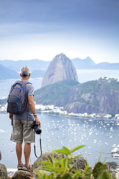 A photographer shooting the the famous Sugar Loaf mountain in Rio de Janeiro, Brazil, South America