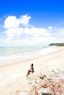 A young woman on Espelho near Trancoso, Bahia, Brazil, South America