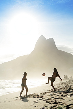 Women playing altinha (football) on Ipanema beach, Rio de Janeiro, Brazil, South America